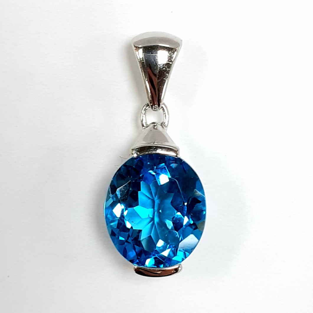 9ct White Gold Blue Topaz Pendant - Product Code - AA56